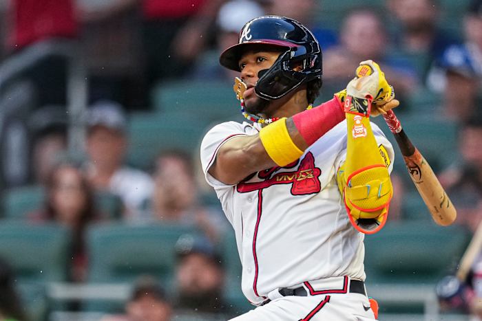 Aug 23, 2023; Cumberland, Georgia, USA; Atlanta Braves right fielder Ronald Acuna Jr. (13) gets an infield single against the New York Mets during the second inning at Truist Park. Mandatory Credit: Dale Zanine-USA TODAY Sports